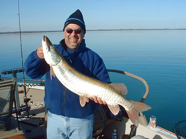 Bob Gravelle and small fish on nice Oct day.